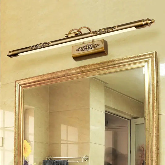 Antique bronze ornate LED bathroom wall lamp above a gold-framed mirror Decorbites on Tampa Home & Garden Store