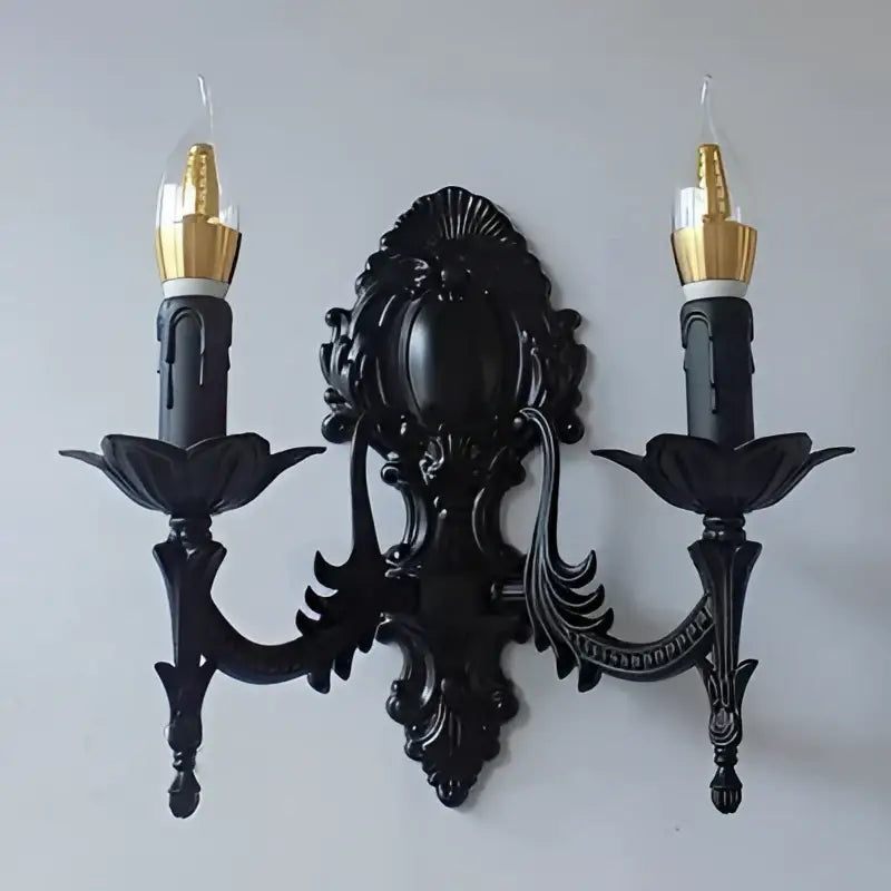Gold Retro Wall Sconce with black ornate backplate and two candle-style arms on Tampa Home & Garden Store