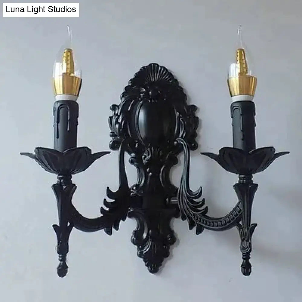 Gold Retro Wall Sconce with black ornate mount and candle-style bulbs on Tampa Home & Garden Store