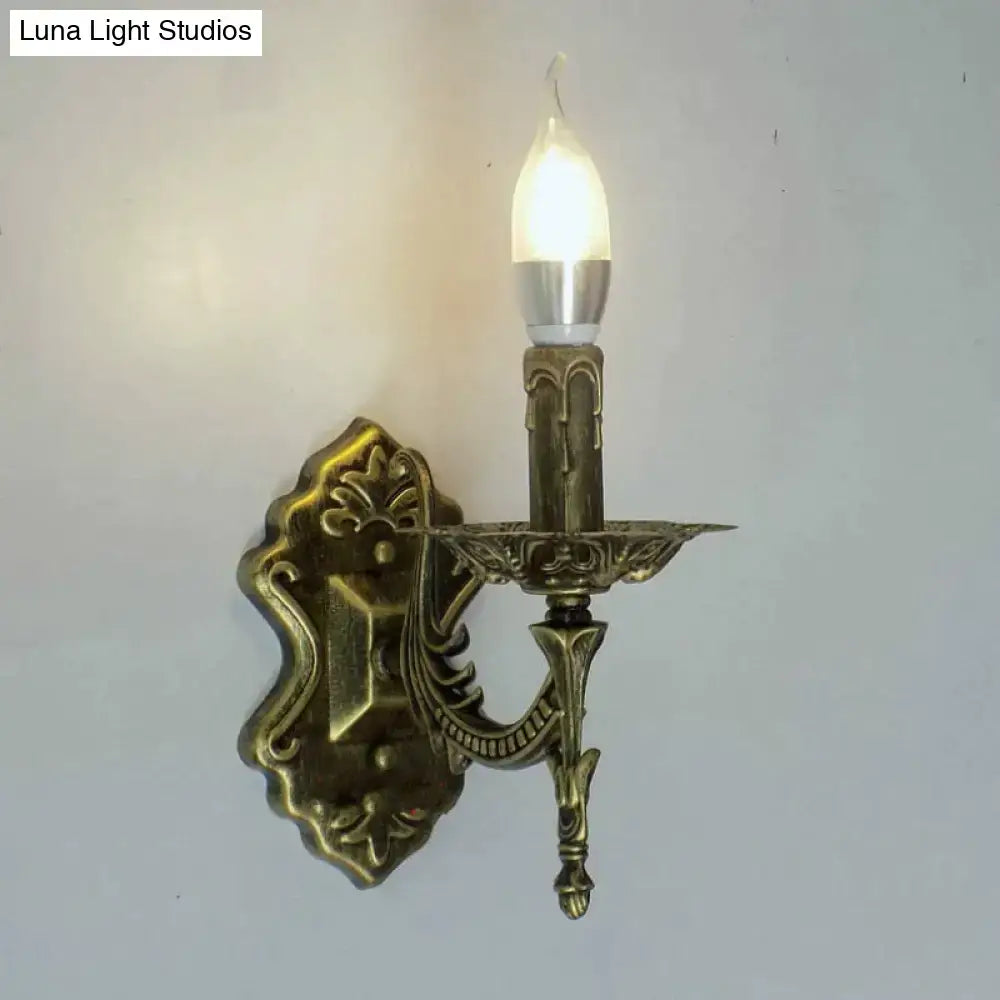 Gold Retro Wall Sconce Decorbites with ornate brass backplate and candle bulb on Tampa Home & Garden Store