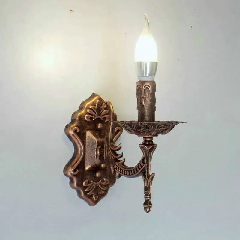 Gold retro wall sconce by Decorbites with ornate bronze finish and candle bulb on Tampa Home & Garden Store