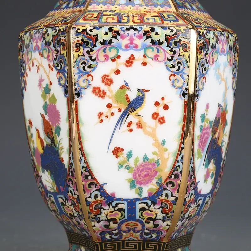 Porcelain octagonal vase by Decorbites with colorful floral bird motif and gold trim on Tampa Home & Garden Store