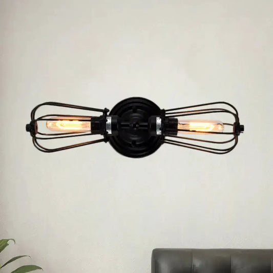 Antique style black and bronze double sconce wall lamp with cage guards and Edison bulbs on Tampa Home & Garden Store