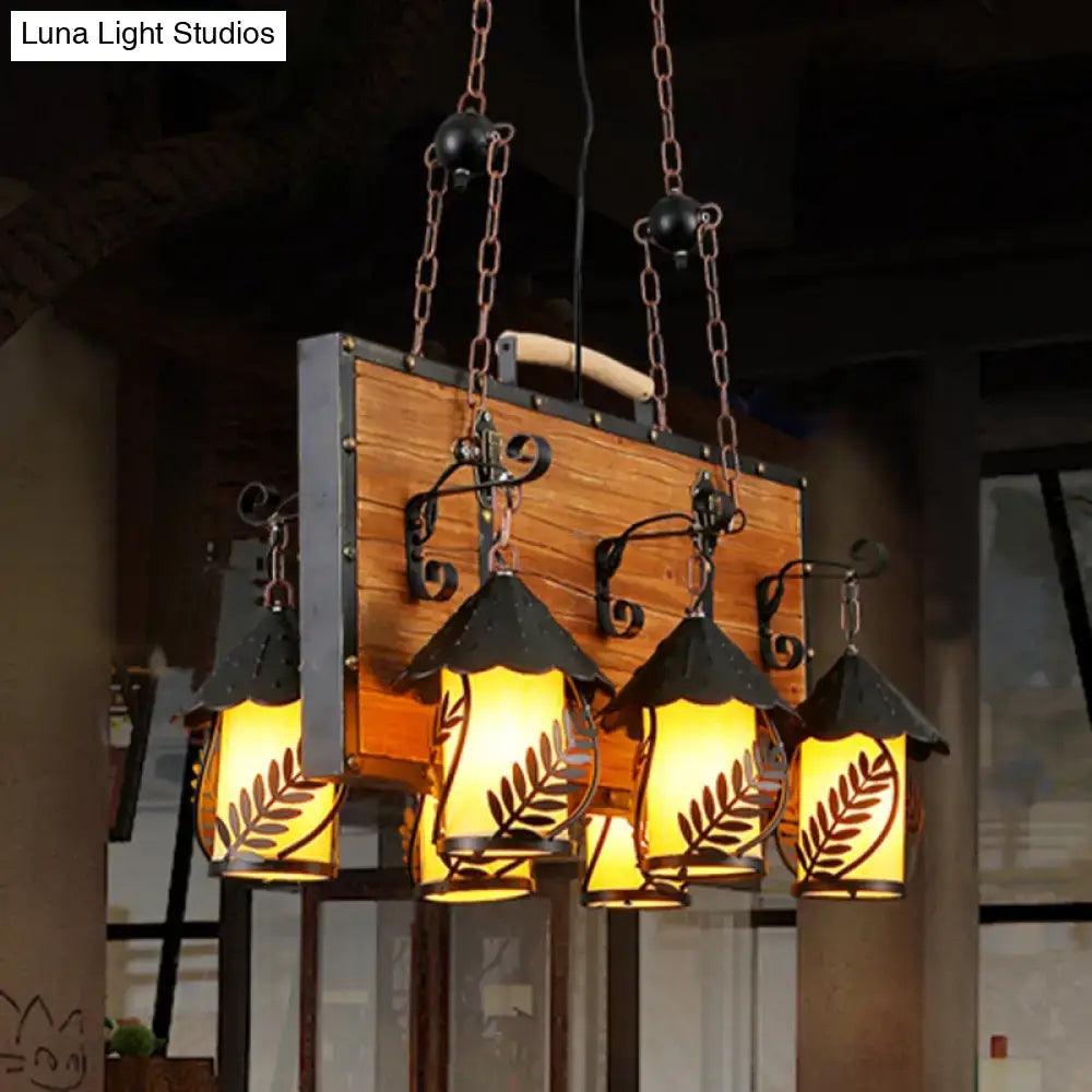 White Glass Chandelier by Decorbites with 4 amber glass lanterns and wrought iron accents on Tampa Home & Garden Store