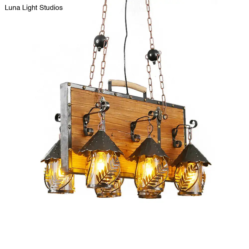 White Glass Chandelier by Decorbites with wood backboard and four amber glass lanterns on Tampa Home & Garden Store