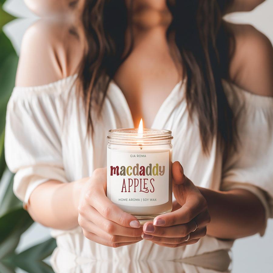MacDaddy Apples candle by Gia Roma in a glass soy wax jar with a lit flame on Tampa Home & Garden Store