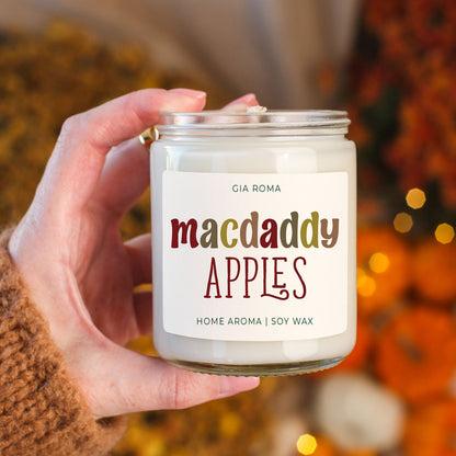 Mac Apple Candle Gia Roma, white soy wax in glass jar with silver lid held in hand on Tampa Home & Garden Store