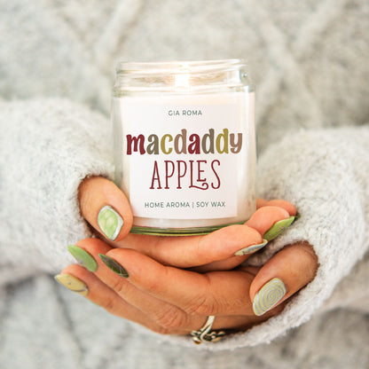 Mac Apple Candle Gia Roma macdaddy apples soy wax in a clear jar held by hands in a grey sweater on Tampa Home & Garden Store