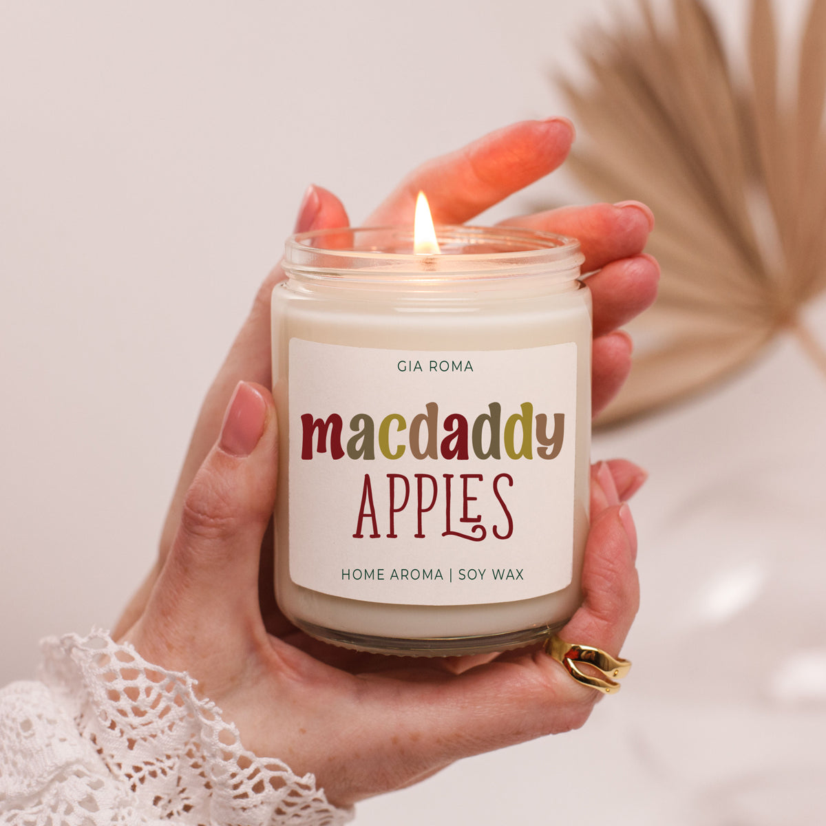 Mac Apple Candle glass jar by Gia Roma with macdaddy apples label and soy wax lit on Tampa Home & Garden Store