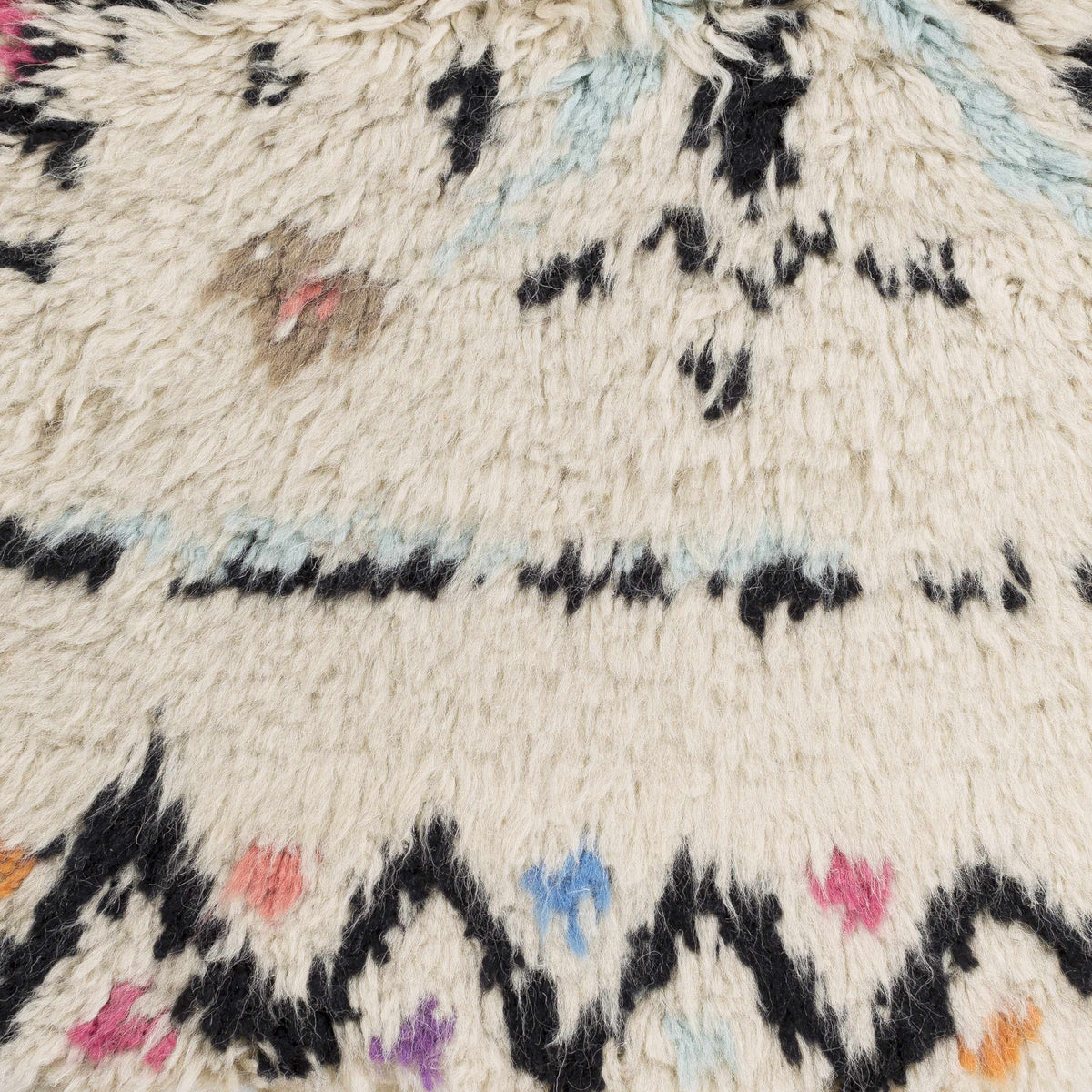 Arcanum Hand Knotted Wool Area Rug cream base with multicolor tufted pattern Boutique Rugs on Tampa Home & Garden Store