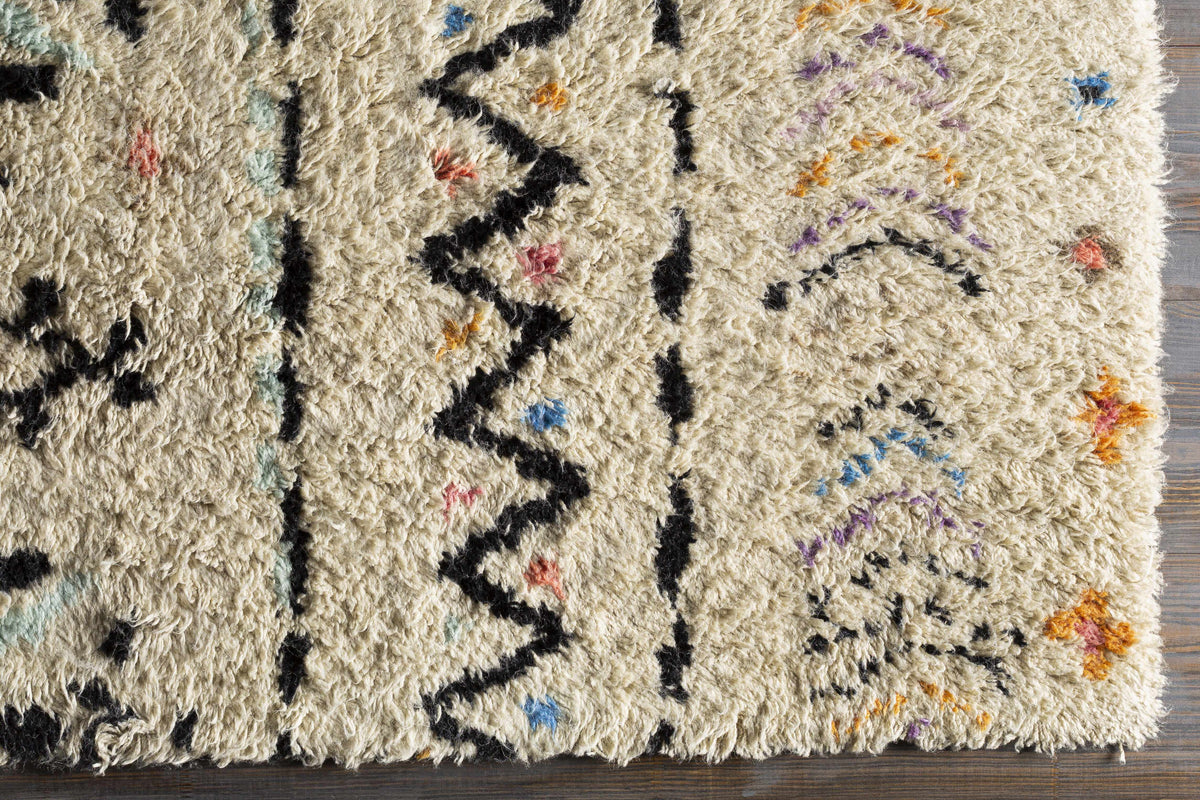 Arcanum hand-knotted wool area rug cream field with black geometric lines and colorful flecks on Tampa Home & Garden Store