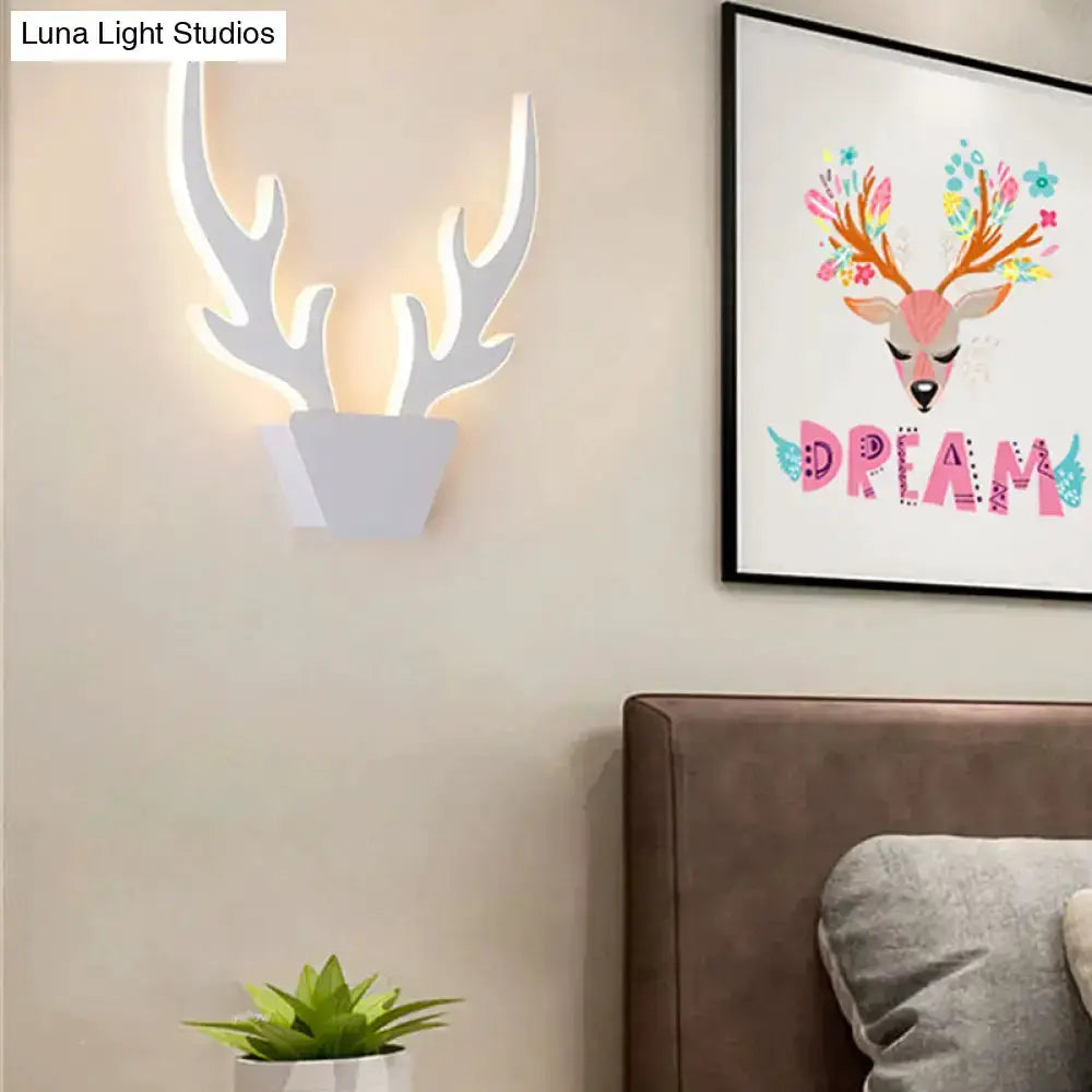 Art deco antler wall sconce in white with backlit glow for bedroom decor on Tampa Home & Garden Store