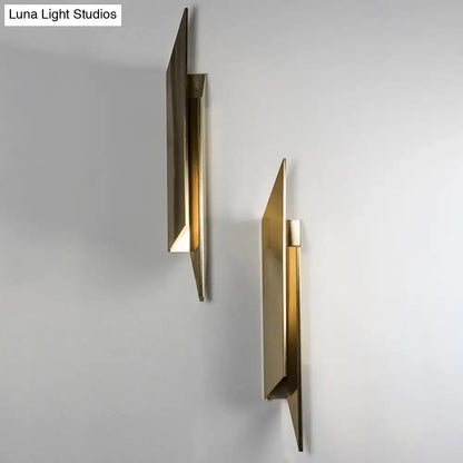 Gold geometric wall sconces (pair) by Decorbites, brass angular panels on gray wall on Tampa Home & Garden Store