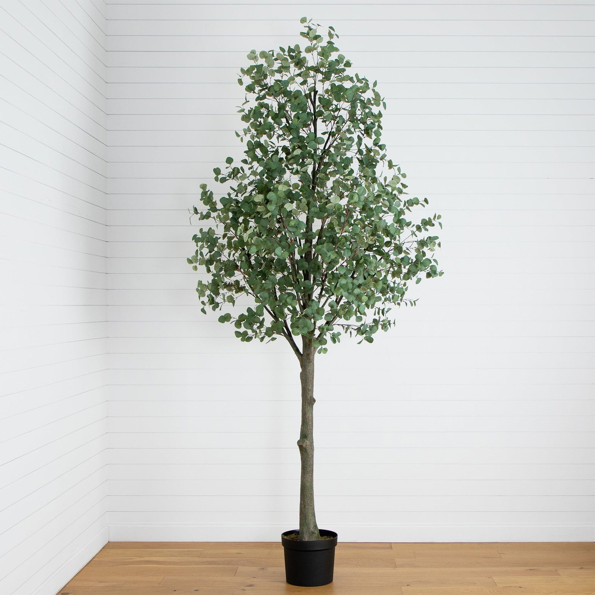 12' artificial eucalyptus tree by Nearly Natural in a black planter with lush green leaves on Tampa Home & Garden Store