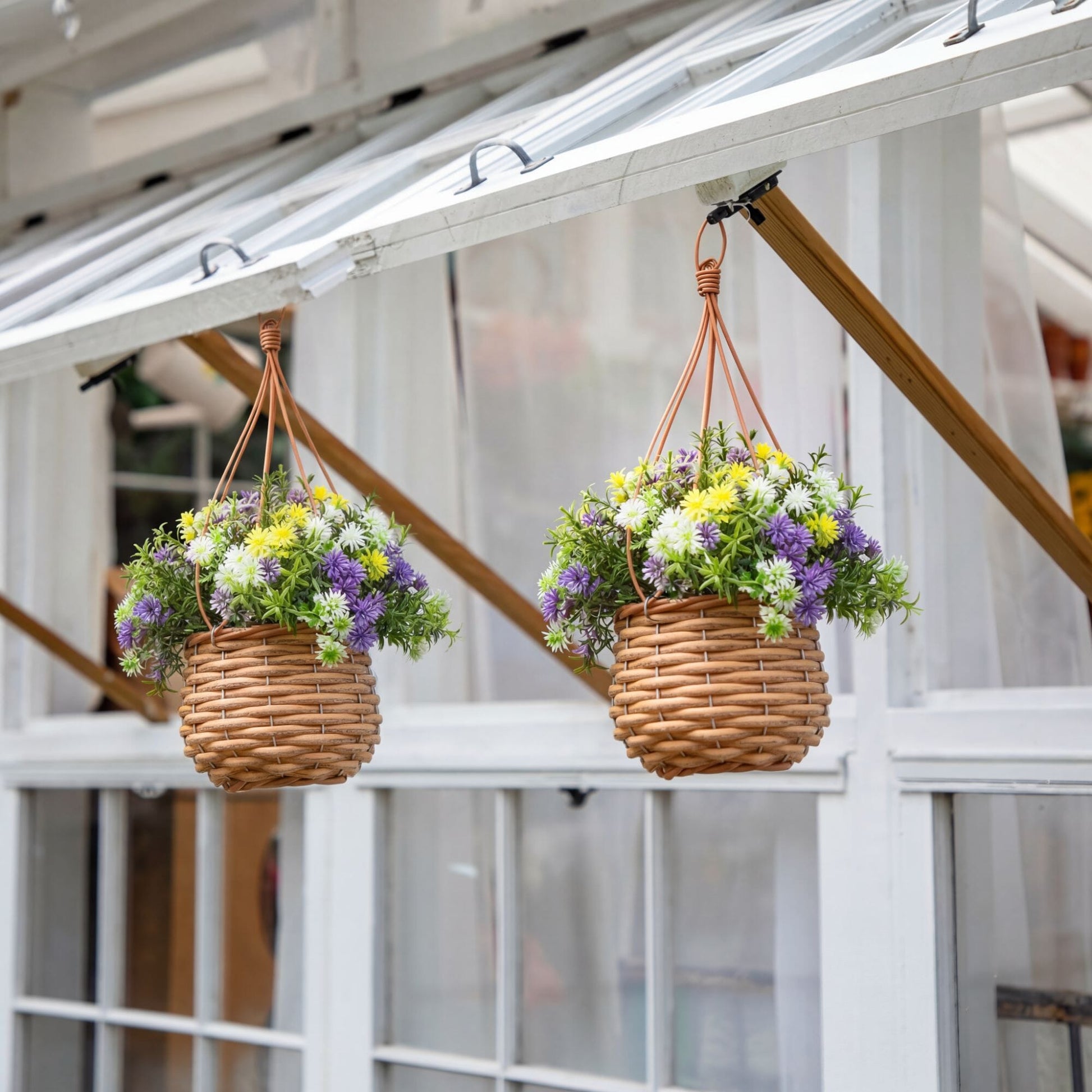 Hanging baskets set of 2 with UV‑resistant artificial dandelion and rosemary in blooms in woven baskets on Tampa Home & Garden Store