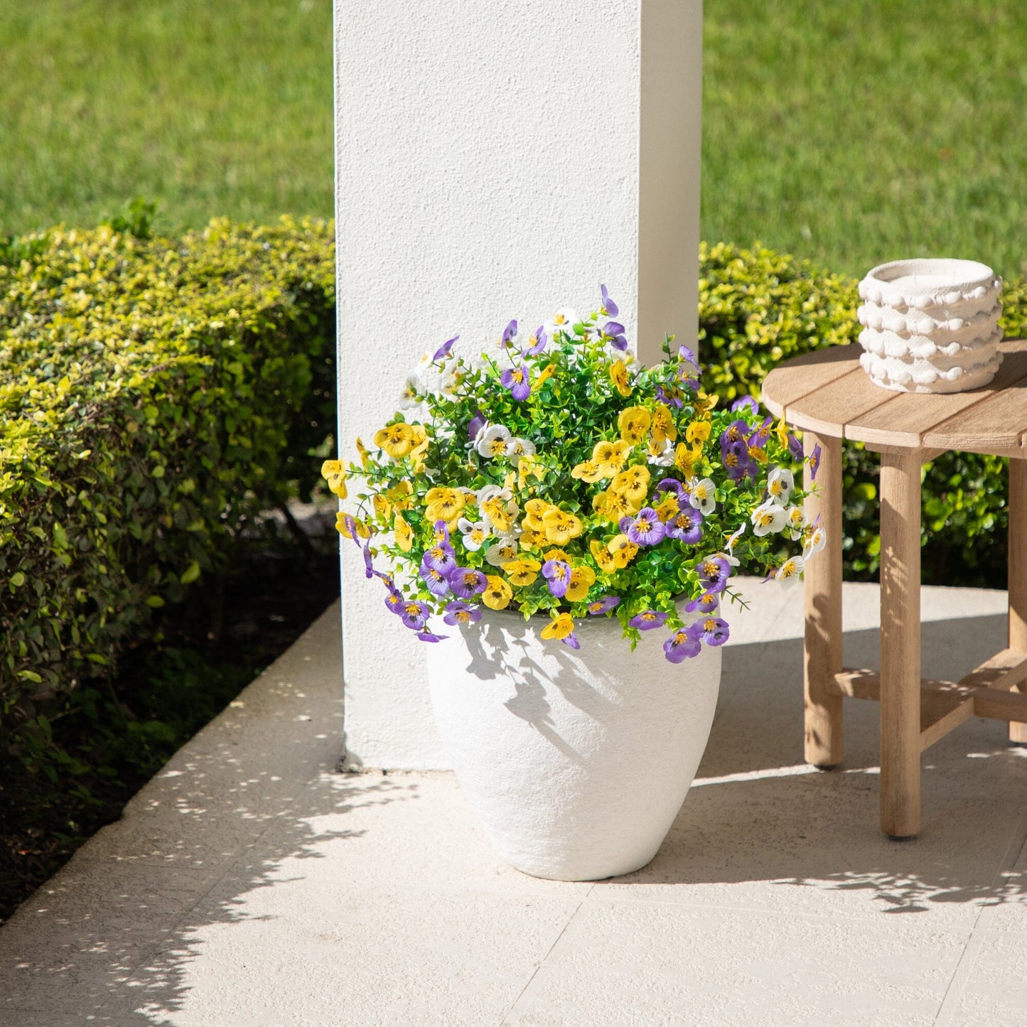 13in UV resistant artificial pansy bush set of 12 with yellow purple blooms on white column on Tampa Home & Garden Store