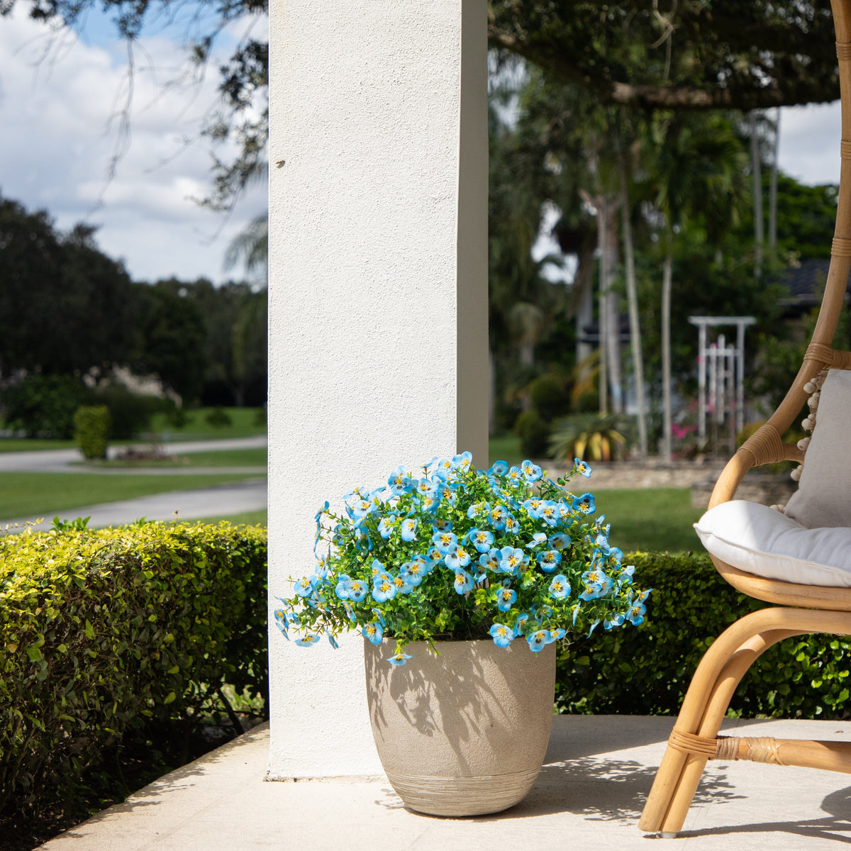 Artificial Pansy Bush set of 12, 13in UV resistant blue blooms in a planter near a white column outdoors Nearly Natural on Tampa Home & Garden Store
