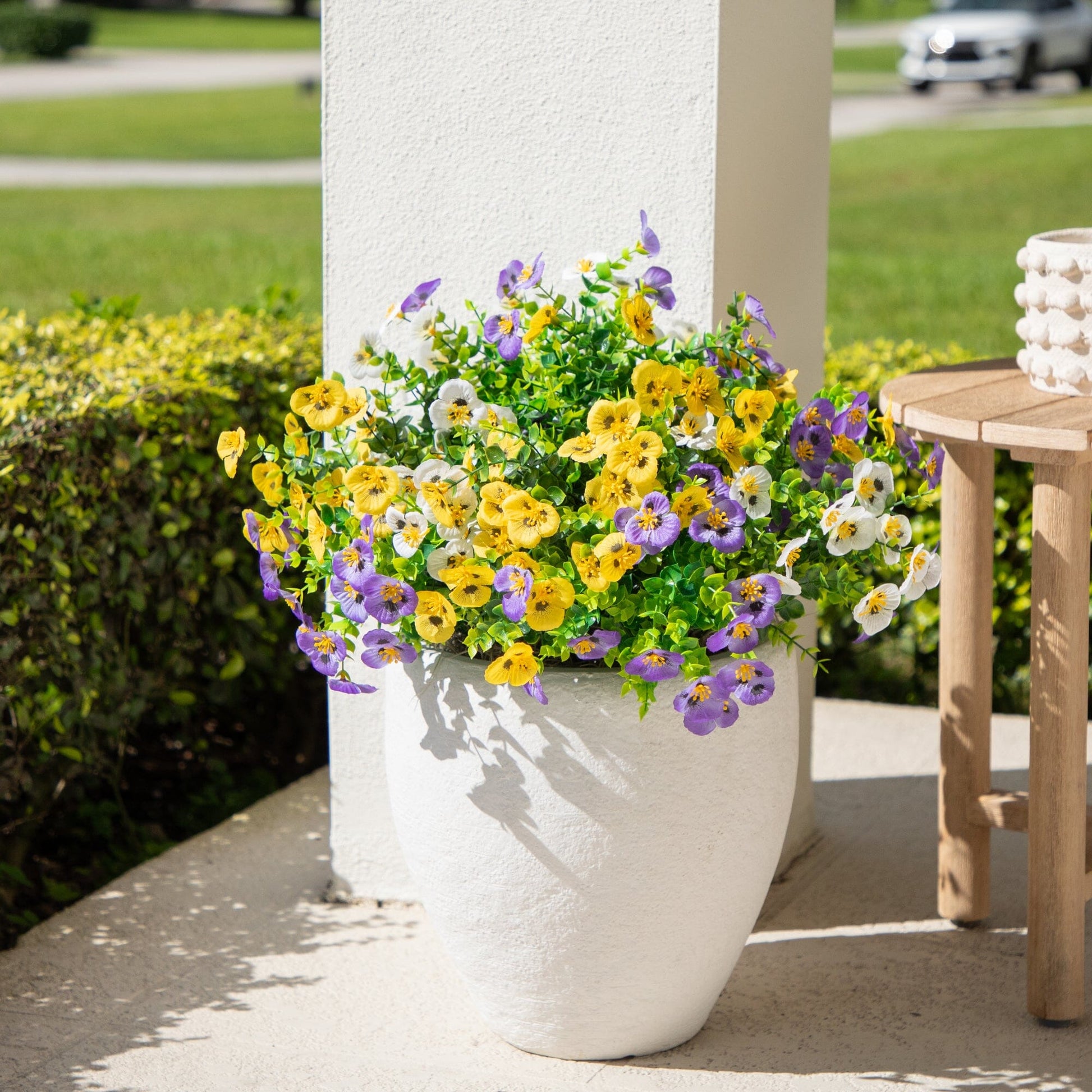 13in UV resistant artificial pansy bush set of 12 with blooms in a white planter on a porch on Tampa Home & Garden Store