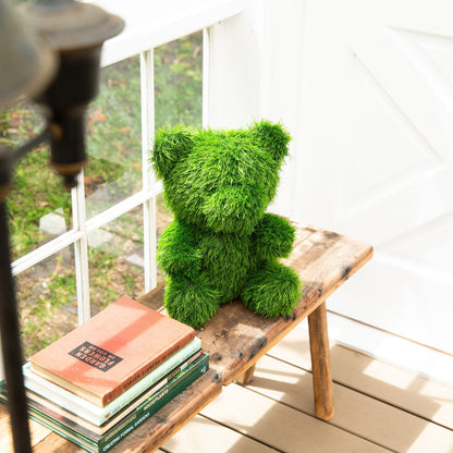 14in UV-resistant artificial grass topiary bear by Nearly Natural on a bench by a white window on Tampa Home & Garden Store
