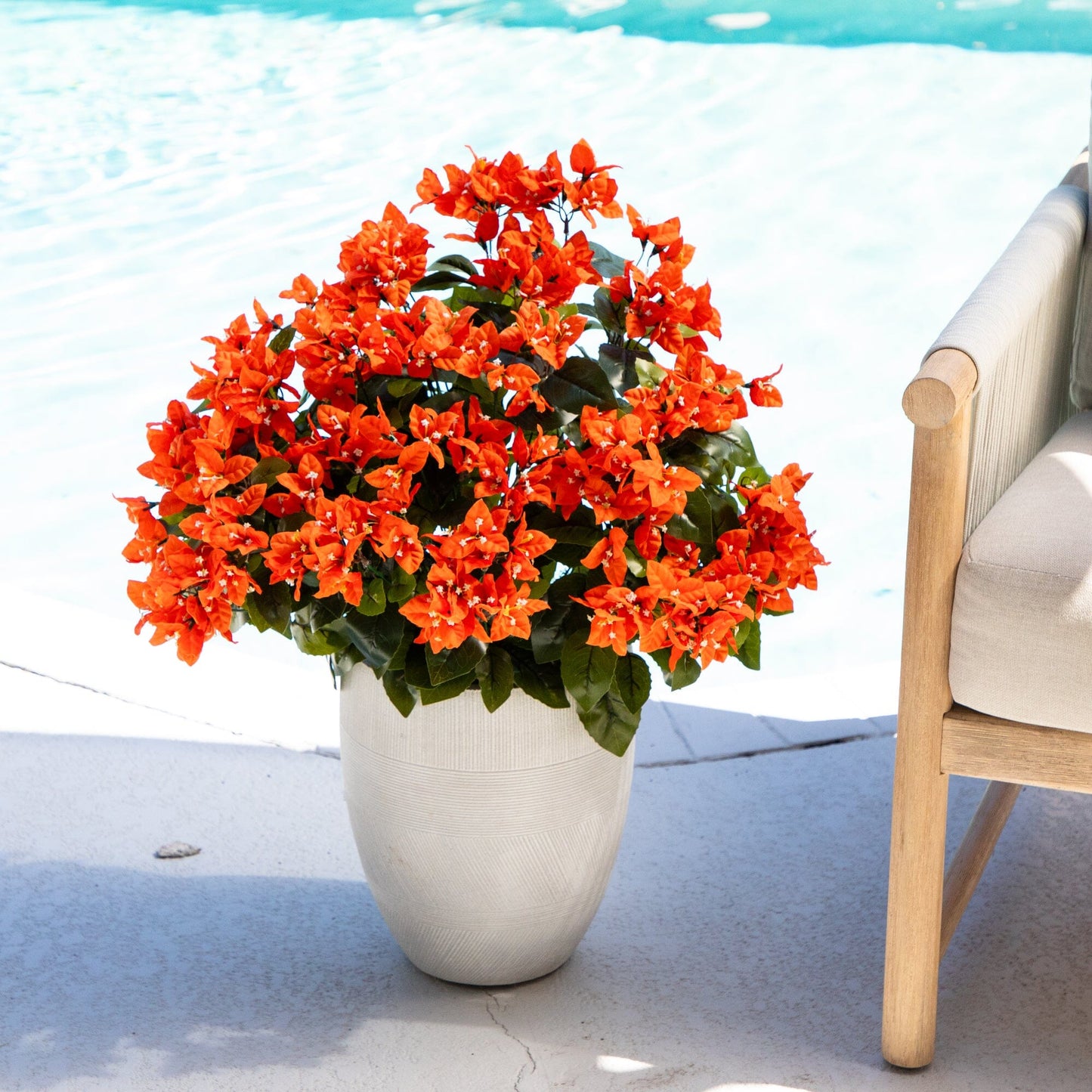 19-inch UV-resistant artificial bougainvillea bush set of 4 with orange blooms in beige pot on Tampa Home & Garden Store