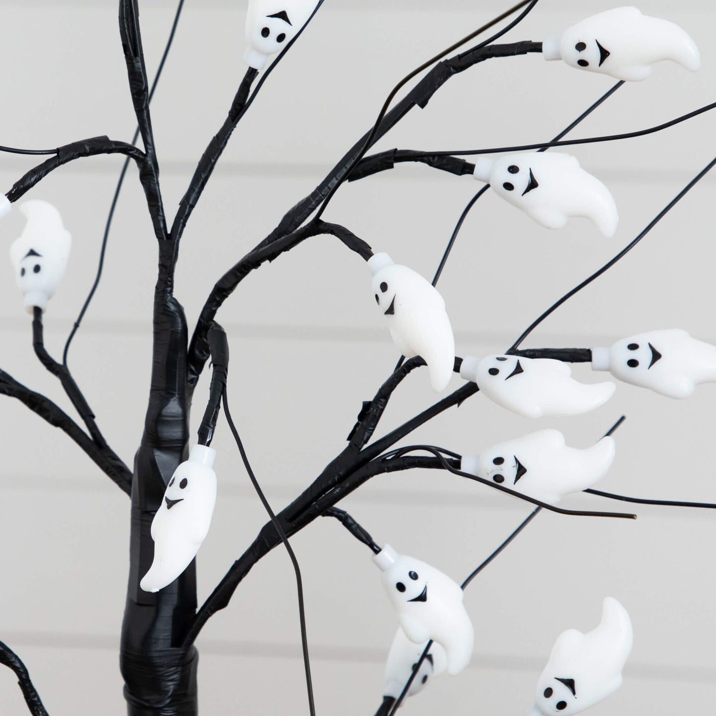 2' pre-lit ghost twig tree with 24 purple LEDs, white ghost ornaments on Tampa Home & Garden Store