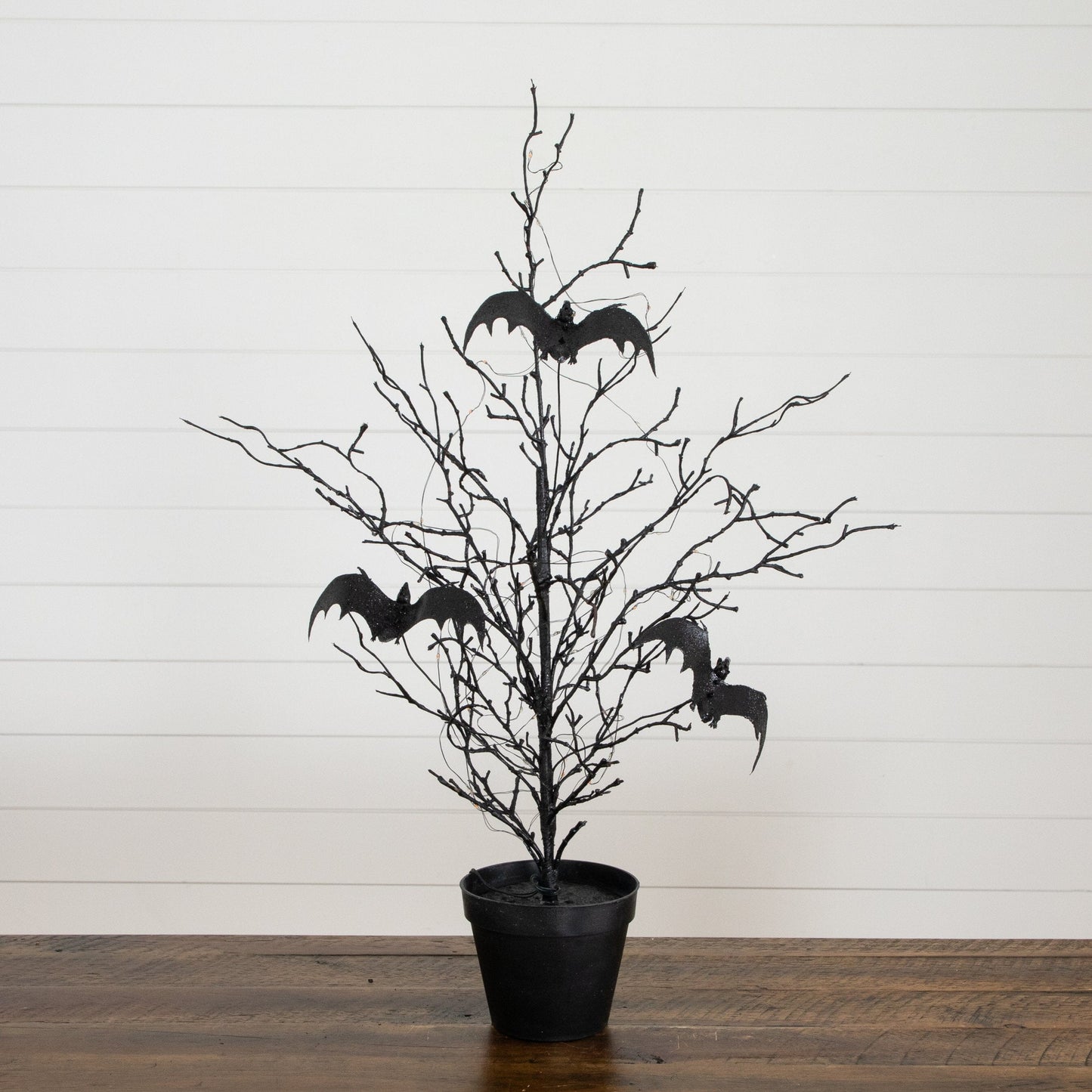 2' Nearly Natural black spooky twig tree with bat silhouettes, lit with orange and purple LEDs on Tampa Home & Garden Store
