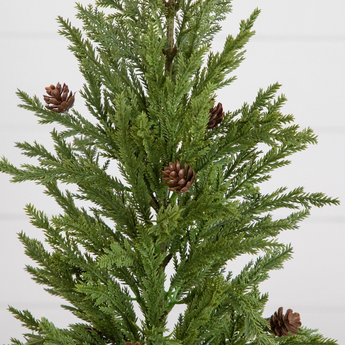 20-inch artificial cedar pine tree with pinecones in white ceramic planter on Tampa Home & Garden Store