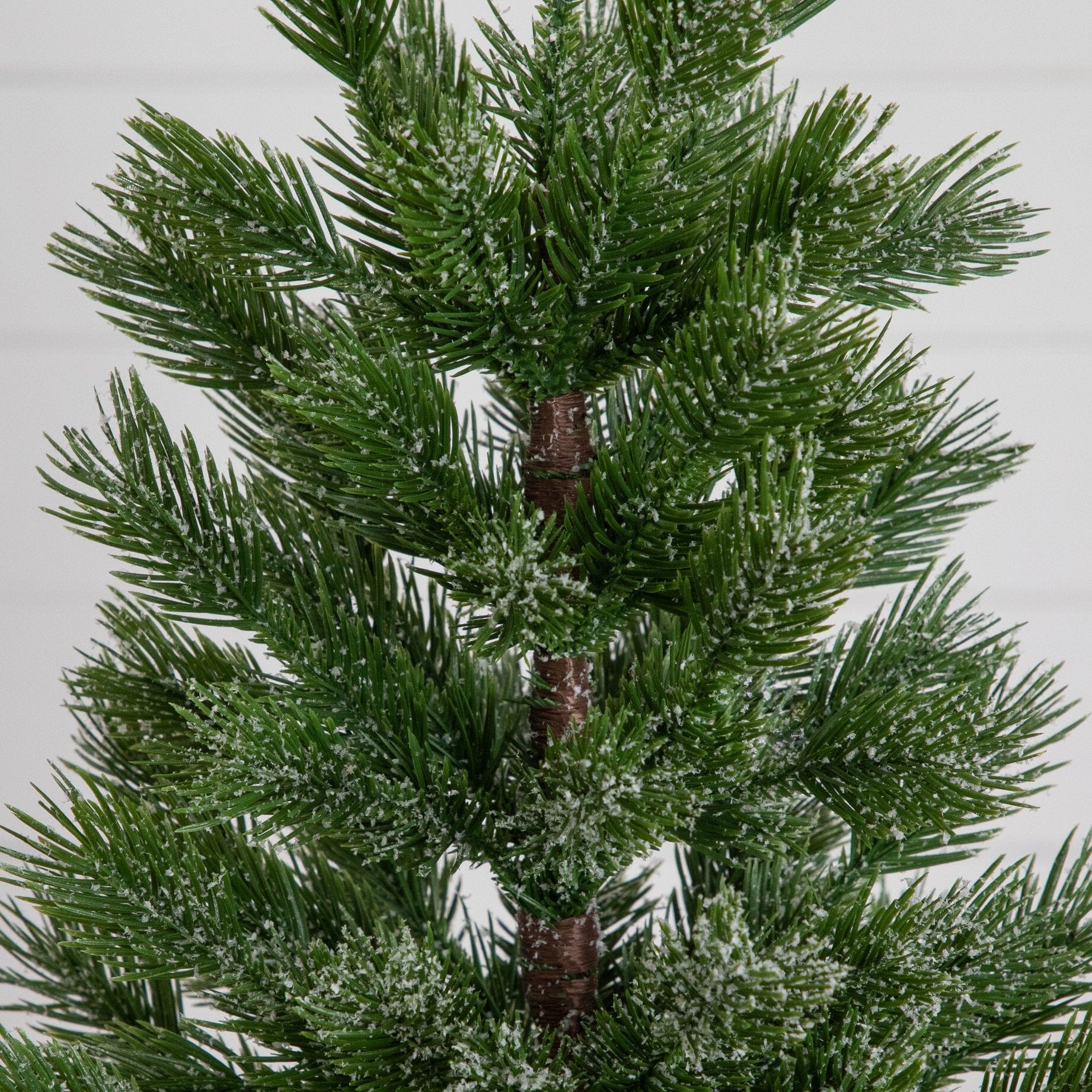 22in artificial frosted Christmas tree closeup with green needles and white frost on trunk on Tampa Home & Garden Store