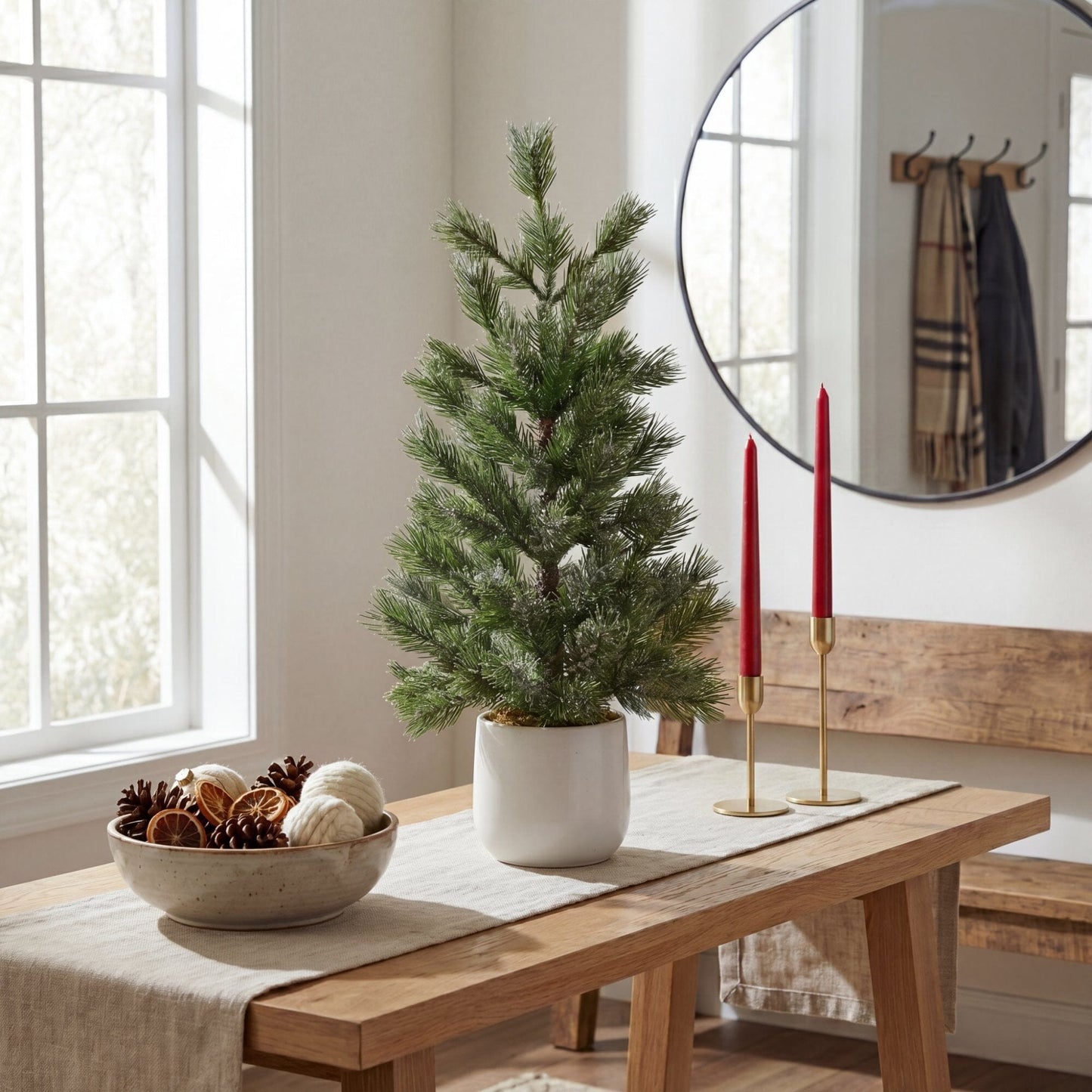 22-inch Nearly Natural frosted artificial Christmas tree in white ceramic planter on a wooden table on Tampa Home & Garden Store