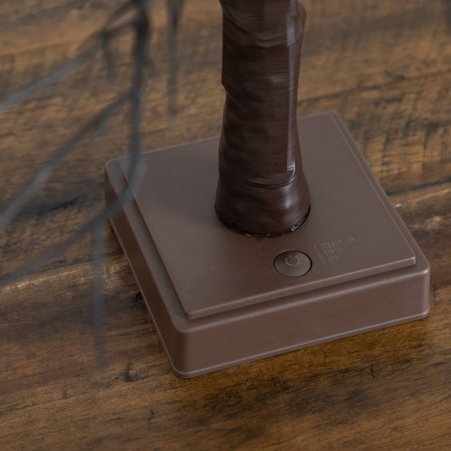 Nearly Natural 22in brown twig tree trunk on square base with visible timer switch on Tampa Home & Garden Store