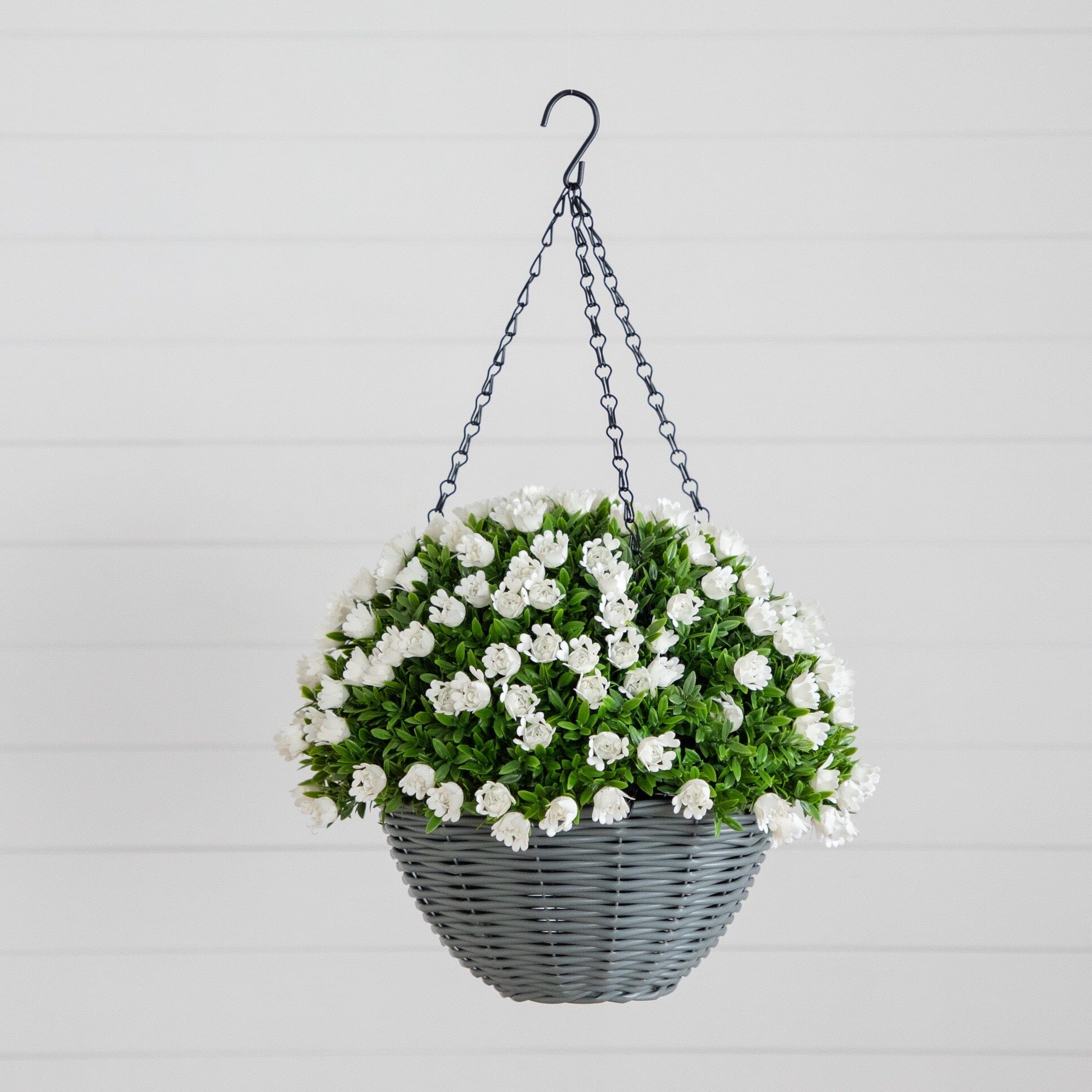 22-inch UV resistant artificial mini rose and aptenia hanging basket with white blooms and green foliage in a gray wicker basket by Nearly Natural on Tampa Home & Garden Store