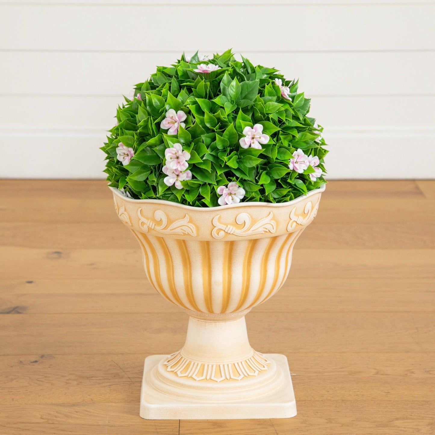 22in UV-resistant artificial pink flowering topiary in a decorative urn planter with green leaves on Tampa Home & Garden Store