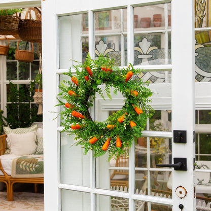 22-inch artificial Easter Fern and Carrots wreath by Nearly Natural with lush green foliage and orange carrot accents on a white paneled door on Tampa Home & Garden Store