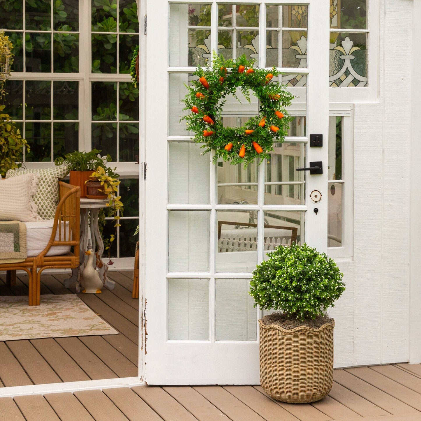 23-inch artificial boxwood topiary with ground stake in wicker planter beside door on Tampa Home & Garden Store