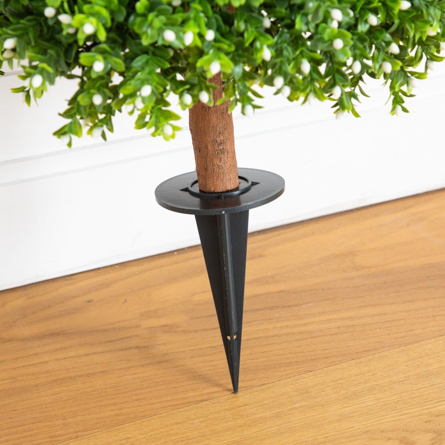 Artificial boxwood topiary with green leaves and white buds on a brown trunk and ground stake on Tampa Home & Garden Store