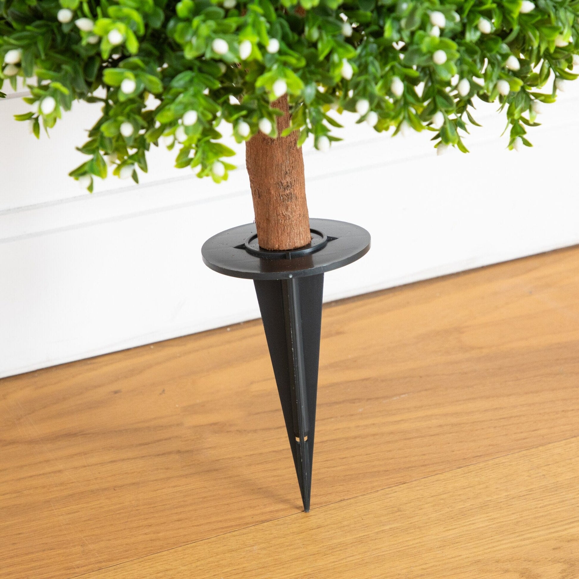 Artificial boxwood topiary with green leaves and white buds on a brown trunk and ground stake on Tampa Home & Garden Store