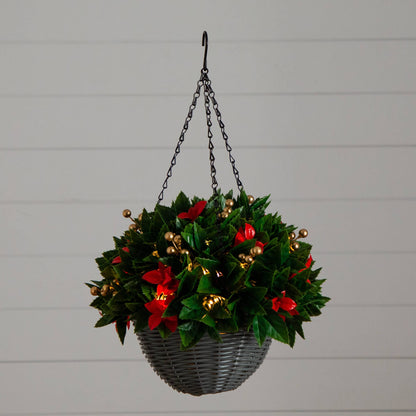 Hanging basket with green Photinia-like leaves, red accents, and gold berry clusters in gray wicker on Tampa Home & Garden Store