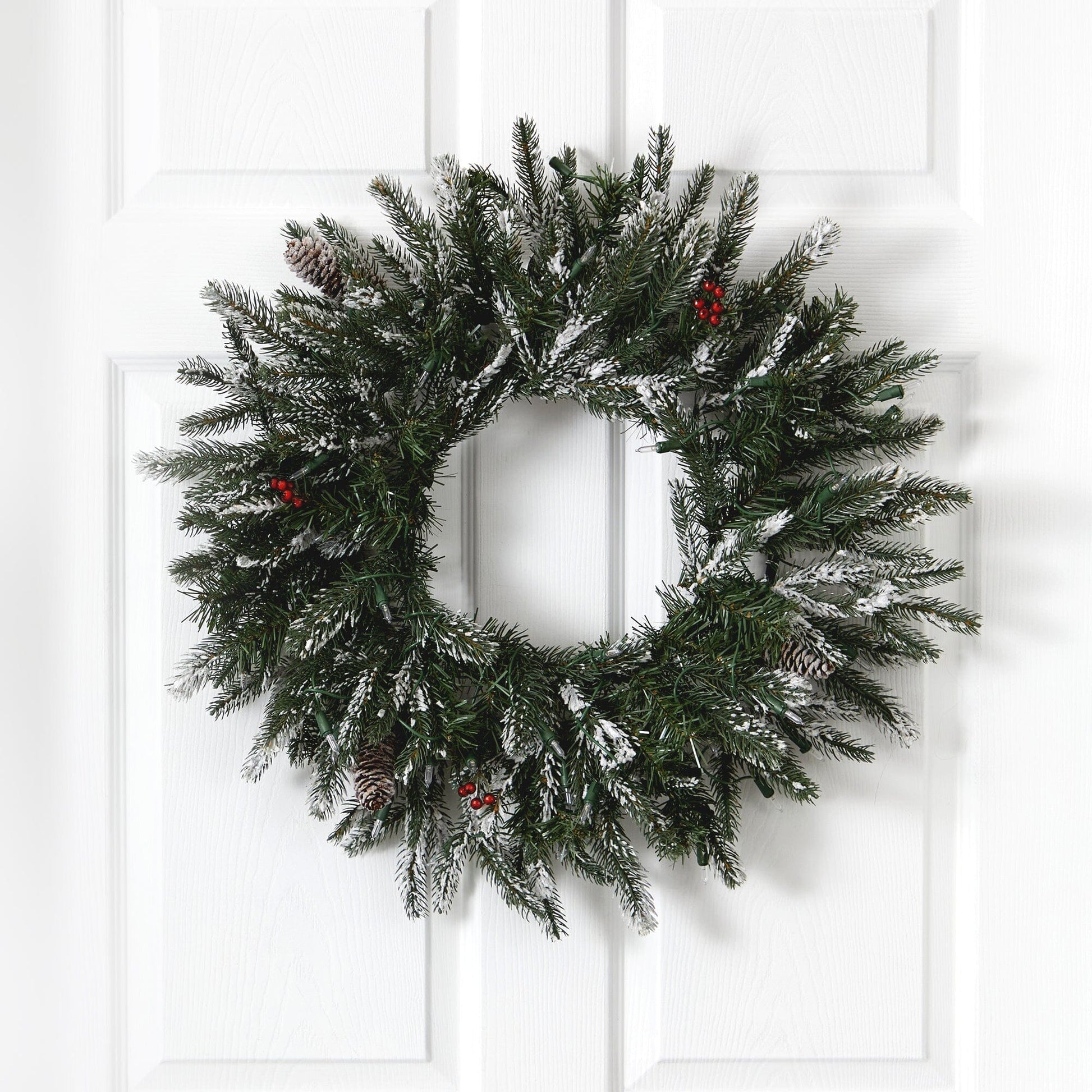 Nearly Natural 24-inch Snowed Artificial Christmas Wreath with 50 warm white LED lights and pine cones on Tampa Home & Garden Store