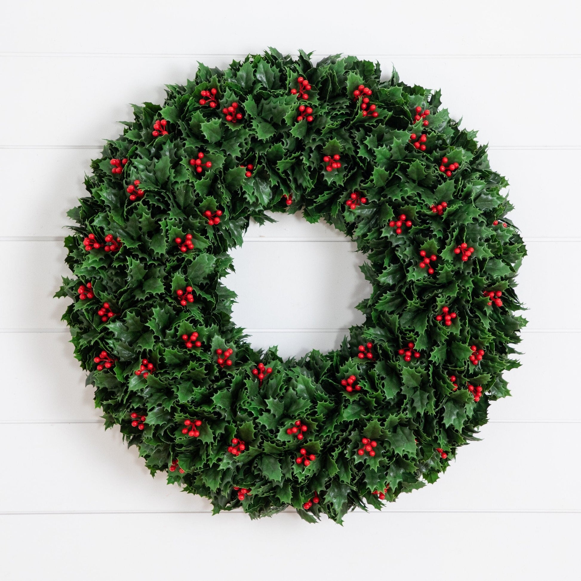Nearly Natural 24-inch UV-resistant holly berry wreath with green leaves and red berries on Tampa Home & Garden Store