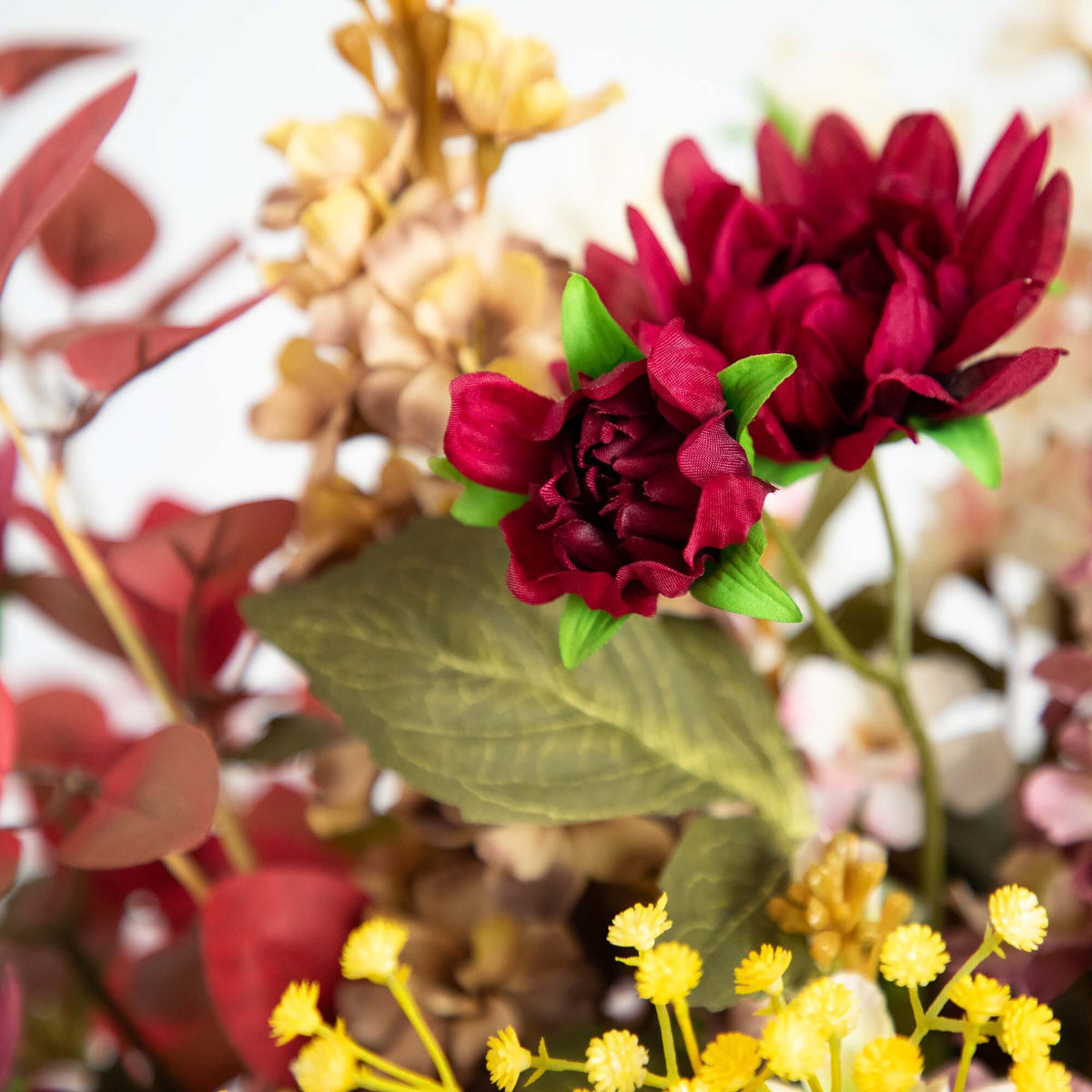 25” Flower Arrangement in Ceramic Vase burgundy blooms, green leaves, and yellow accents on Tampa Home & Garden Store