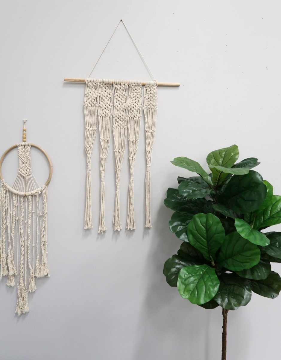 Two cream handwoven macrame wall hangings with tassels on Tampa Home & Garden Store