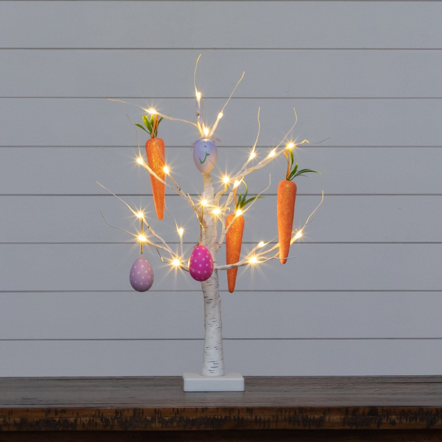 2 ft pre-lit Easter eggs and carrot twig tree with 24 warm LEDs, orange carrots and purple eggs on Tampa Home & Garden Store
