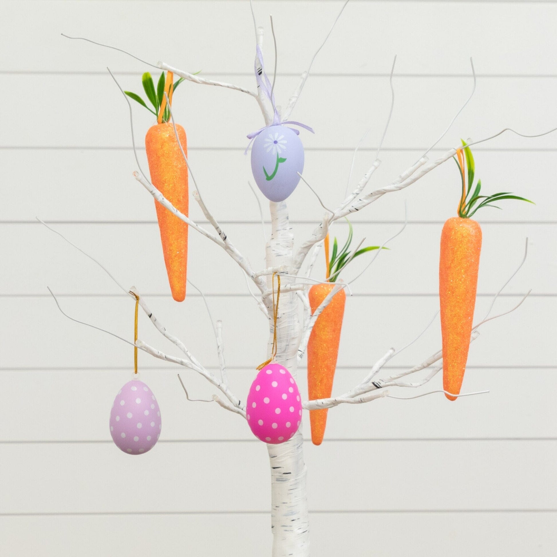 2 ft pre-lit Easter twig tree with orange carrot ornaments and pastel polka-dot eggs on Tampa Home & Garden Store
