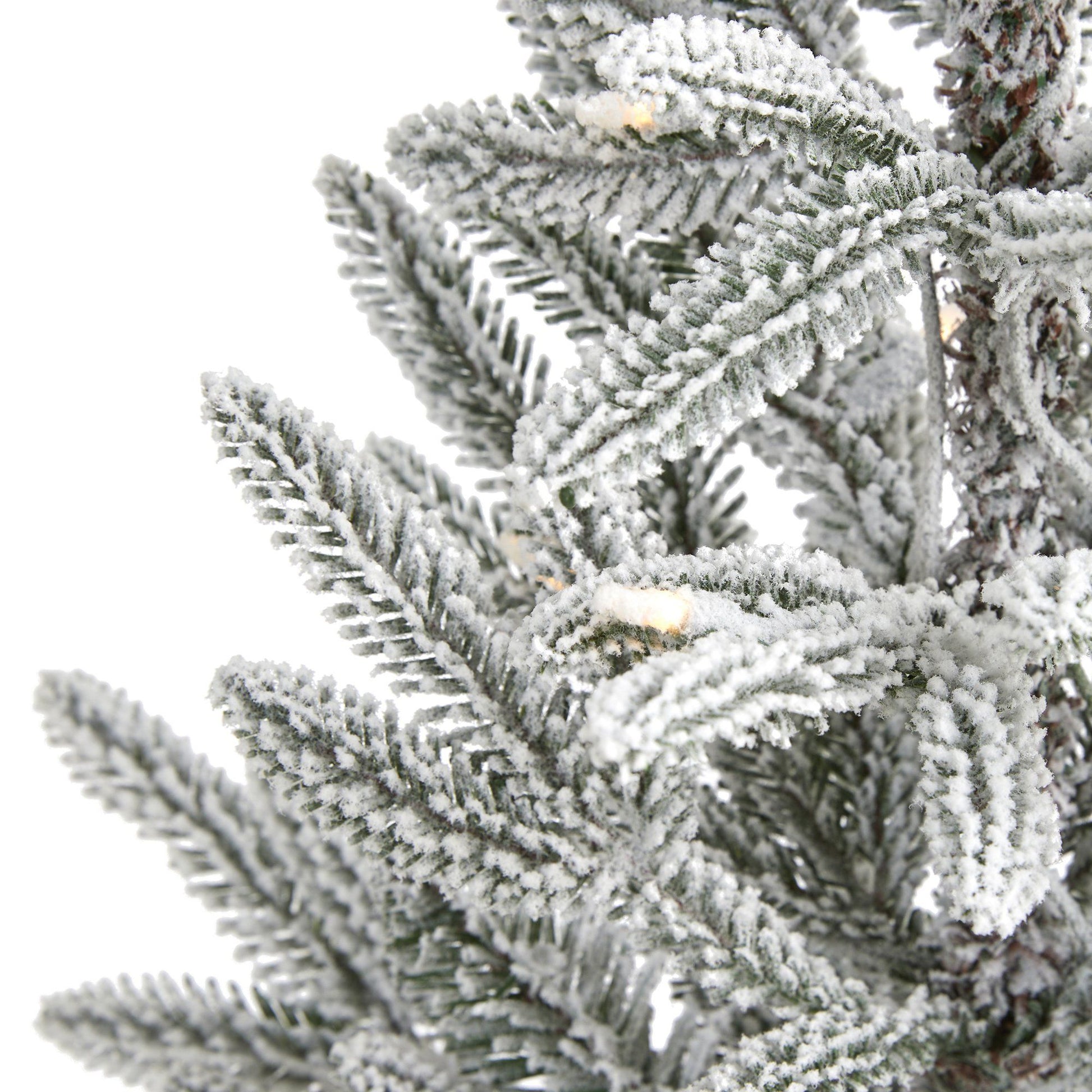 3 ft flocked Manchester Spruce artificial tree branch close-up covered in snow on Tampa Home & Garden Store