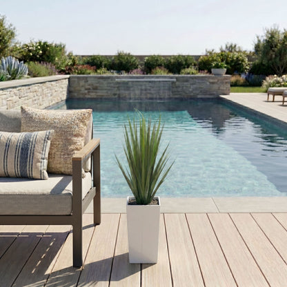 3 ft UV-resistant artificial grass plant in a white tower planter on a poolside deck on Tampa Home & Garden Store