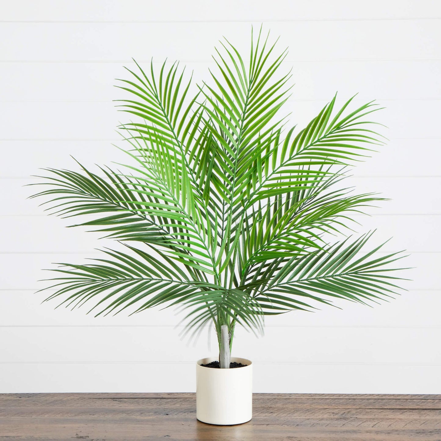 30-inch artificial palm tree by Nearly Natural with green fronds in a white pot on a wooden floor on Tampa Home & Garden Store