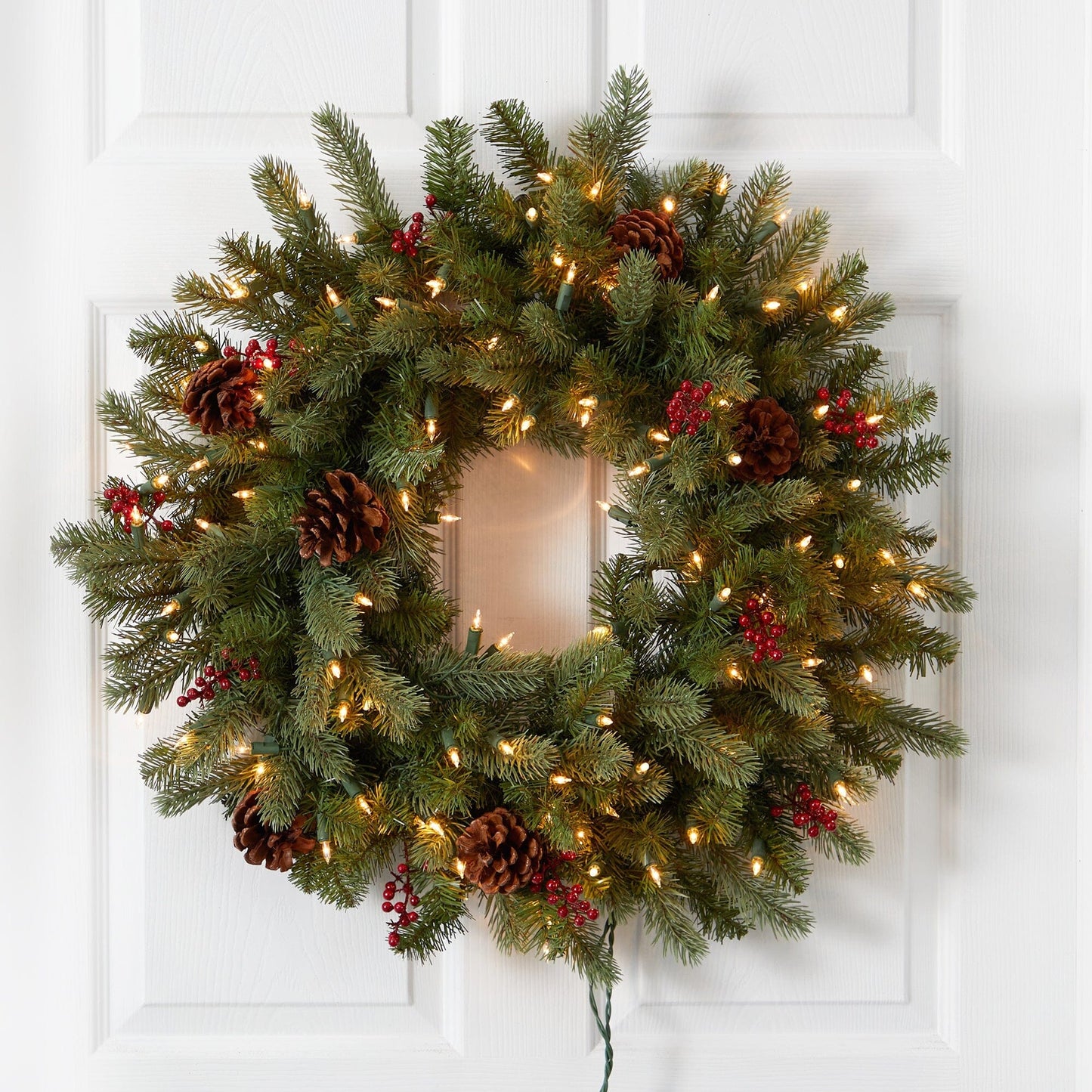 Wreath 30in Nearly Natural lighted pine with berries and pinecones on white door on Tampa Home & Garden Store