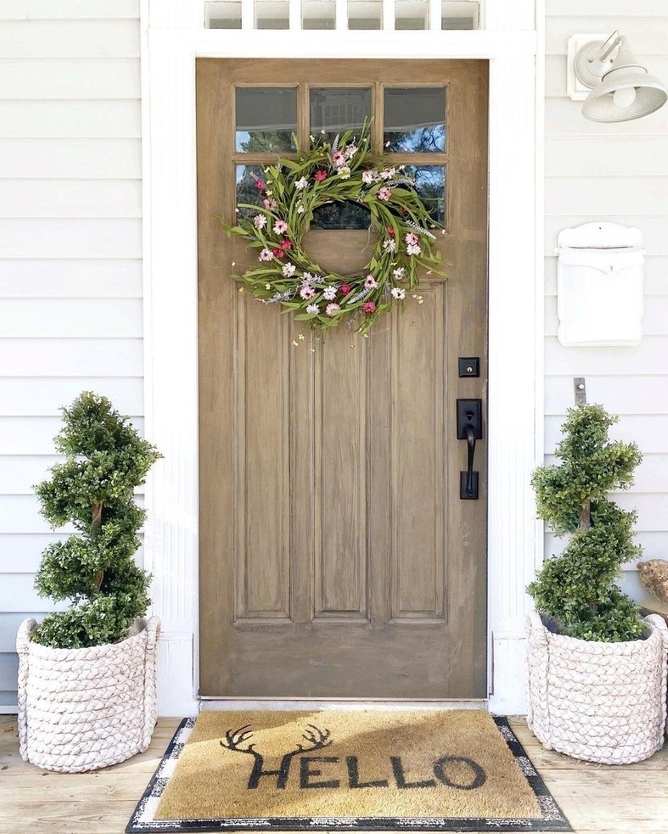 Pair of Nearly Natural 33 in Boxwood Topiary Spiral Artificial Trees in white woven planters flanking a front door on Tampa Home & Garden Store