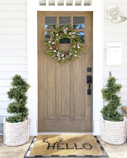Pair of Nearly Natural 33 in Boxwood Topiary Spiral Artificial Trees in white woven planters flanking a front door on Tampa Home & Garden Store