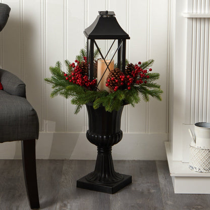33” Holiday greenery with red berries and pinecones around a candle in a black lantern urn on Tampa Home & Garden Store